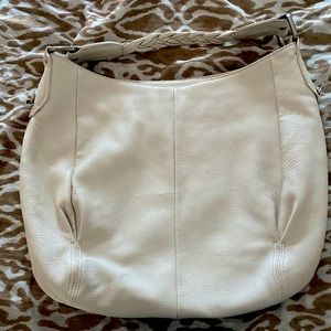 An off white large size bag in good condition no major stains